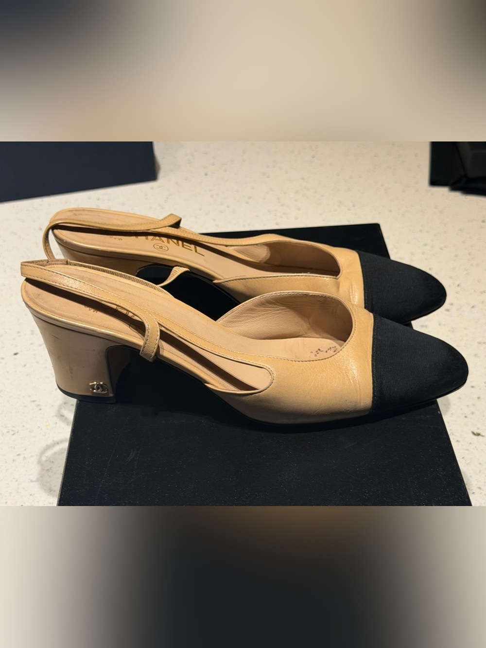 CHANEL Tan Leather Slingback Pumps with Black Cap Toe